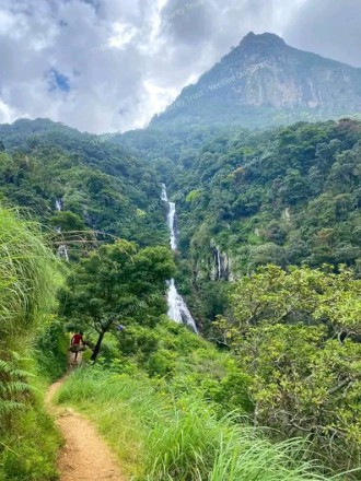 Hillside footpath and waterfall showing surrounding landscape after rains