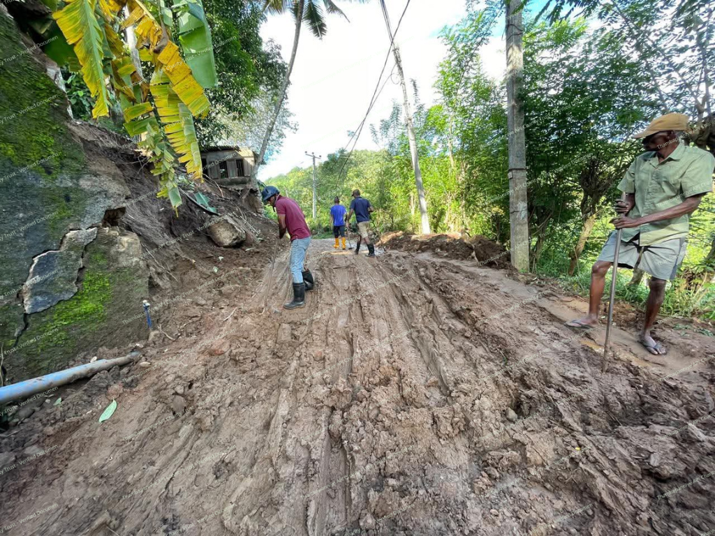 Mud-covered local road after a large slide