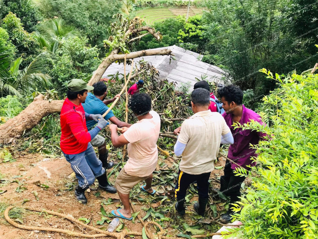 Collapsed hut surrounded by thick mud and debris